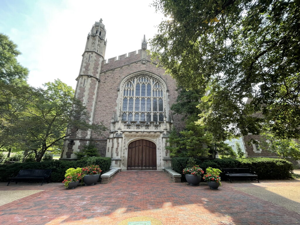 Outside of Graham Memorial Chapel, an old brick Cathedral-style building