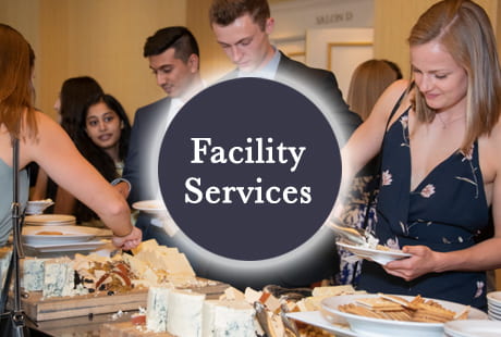 Facilities image of people getting food from a buffet. 